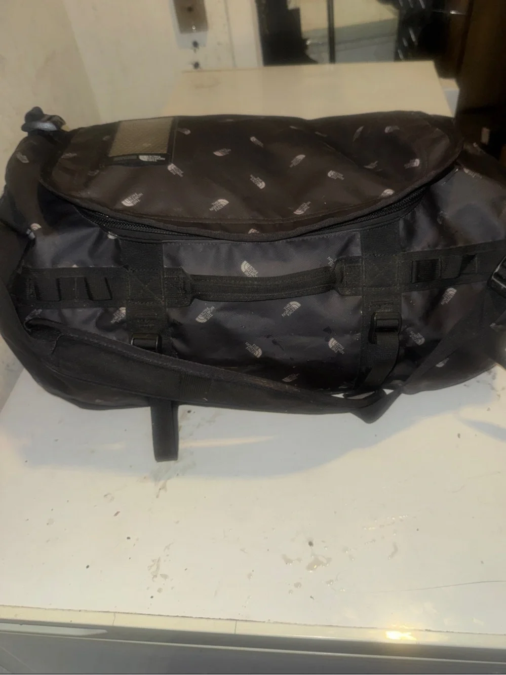 The North Face limited edition Black Duffel Messenger Bag with TNF logo repeat